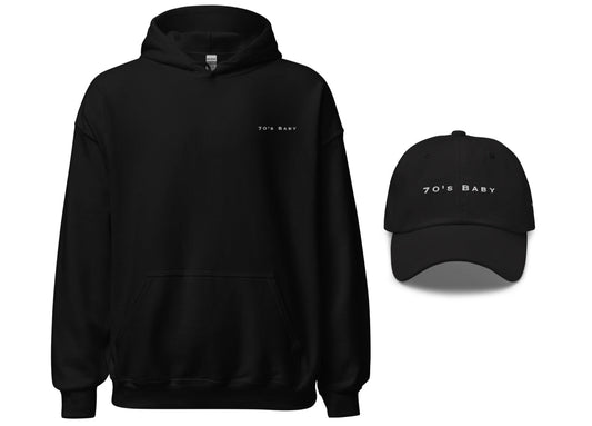 A set consisting of a black lightweight hoodie and a black dad hat, both with white text '70's Baby' on the front.