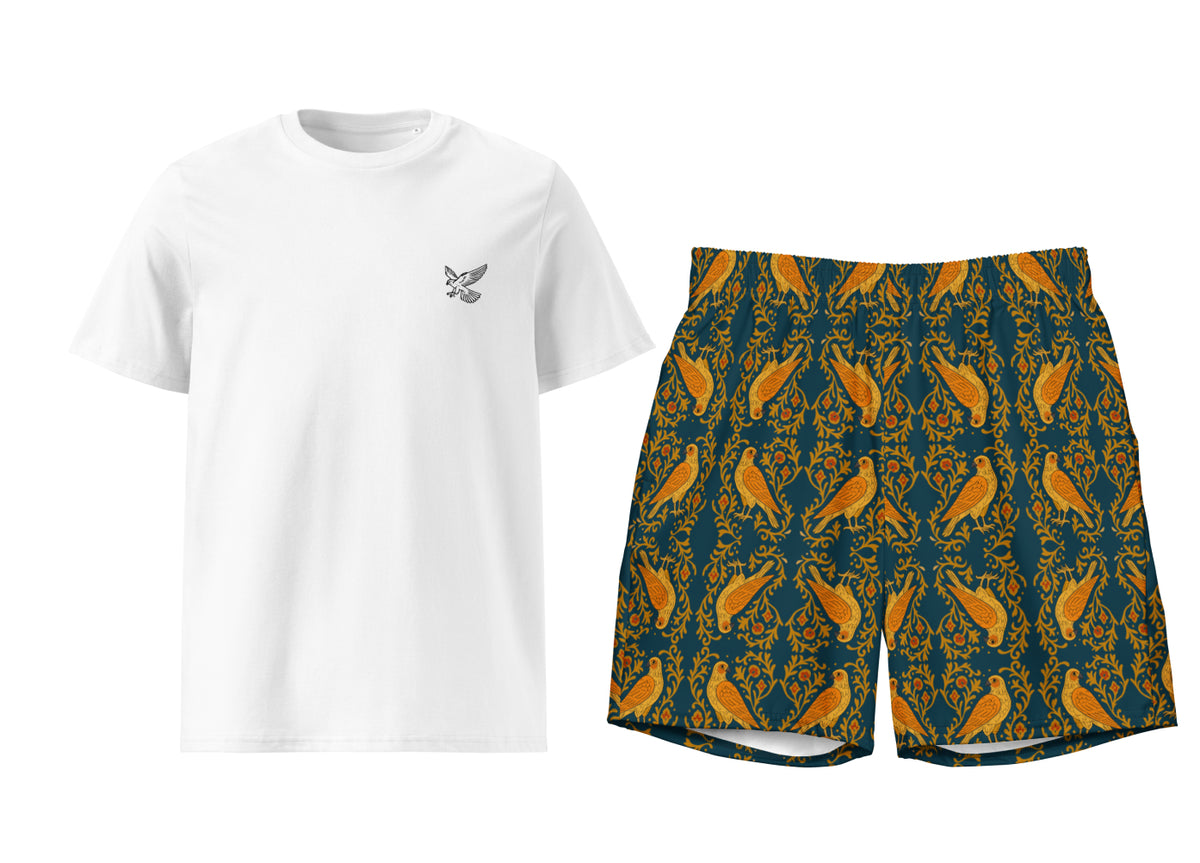 White t-shirt and arabesque falcon patterned shorts on a white background