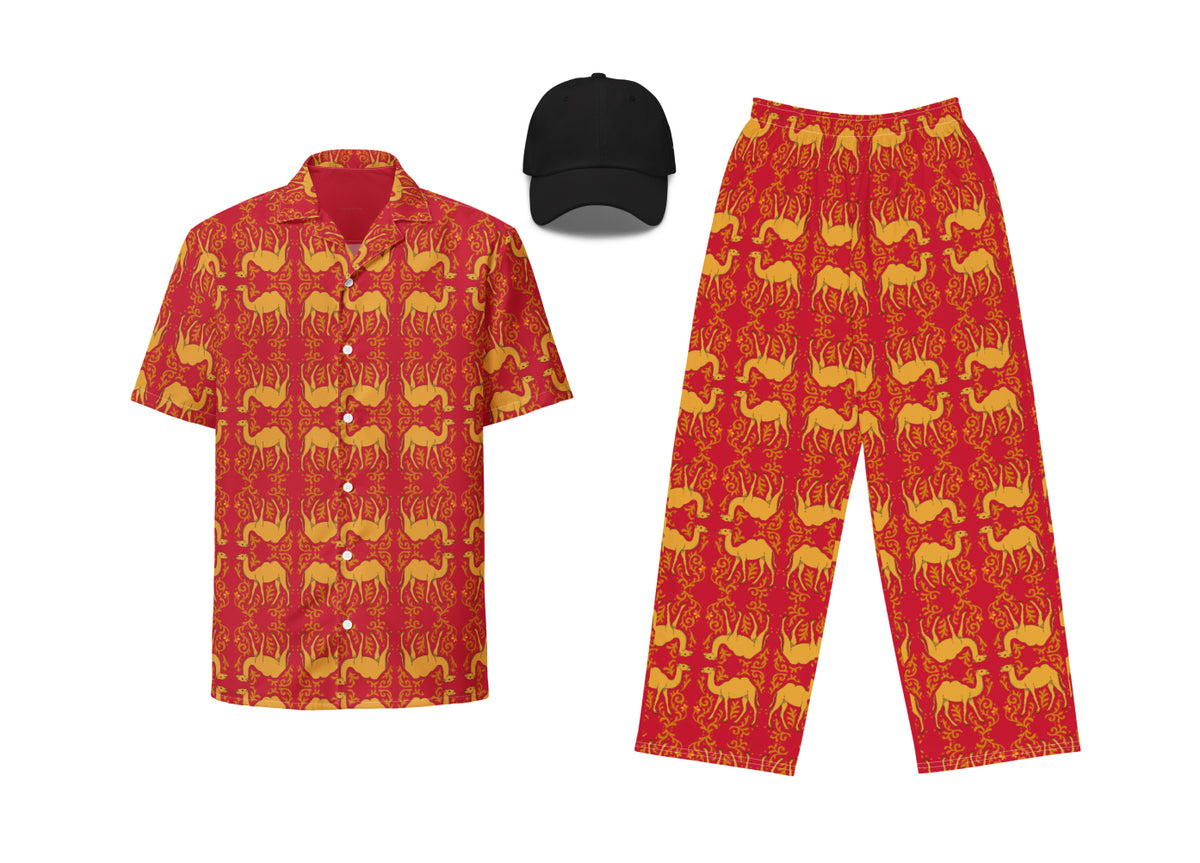 An outfit set including a red button-up shirt with a camel pattern, red wide-leg pants with a camel pattern, and a black dad hat with embroidery.