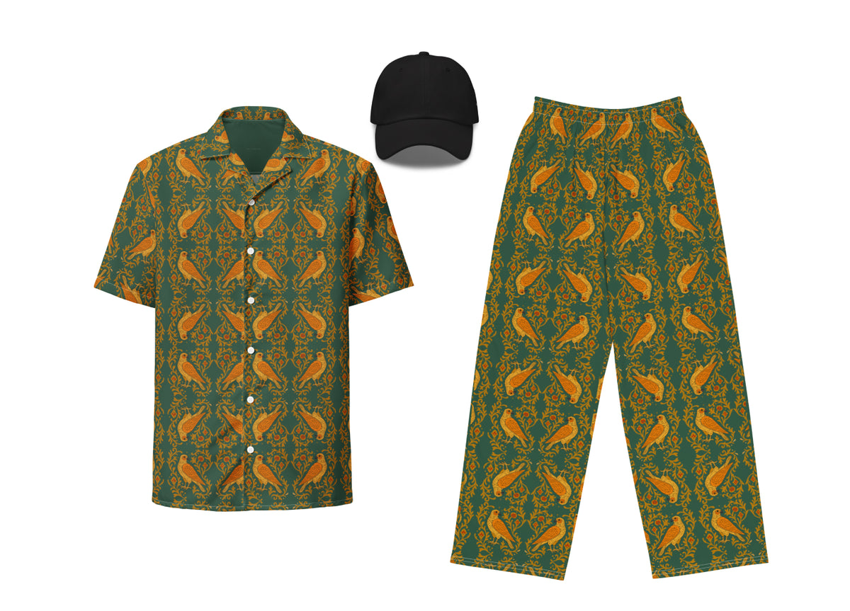 A set of dark green clothing featuring a falcon arabesque pattern, including a button-up shirt, pants, and a dad hat.