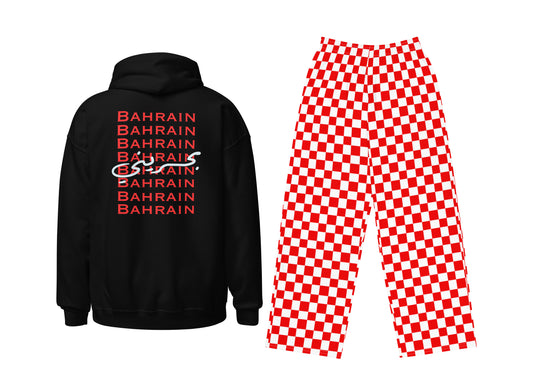 Black hoodie with 'BAHRAIN' text and red checkered pants on a white background
