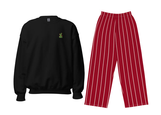 Black sweatshirt with a small embroidered cactus and red pinstripe pants on a white background