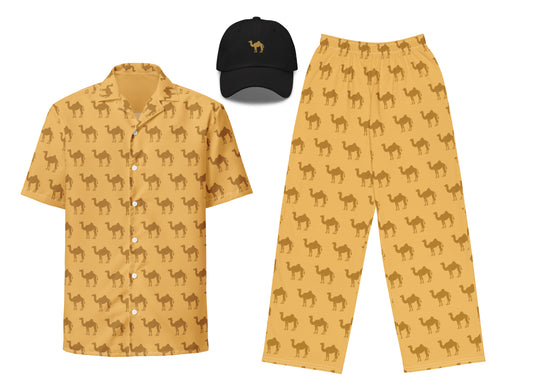 A set of clothing including a yellow shirt with camel patterns, yellow pants with camel patterns, and a black embroidered hat with a camel design.