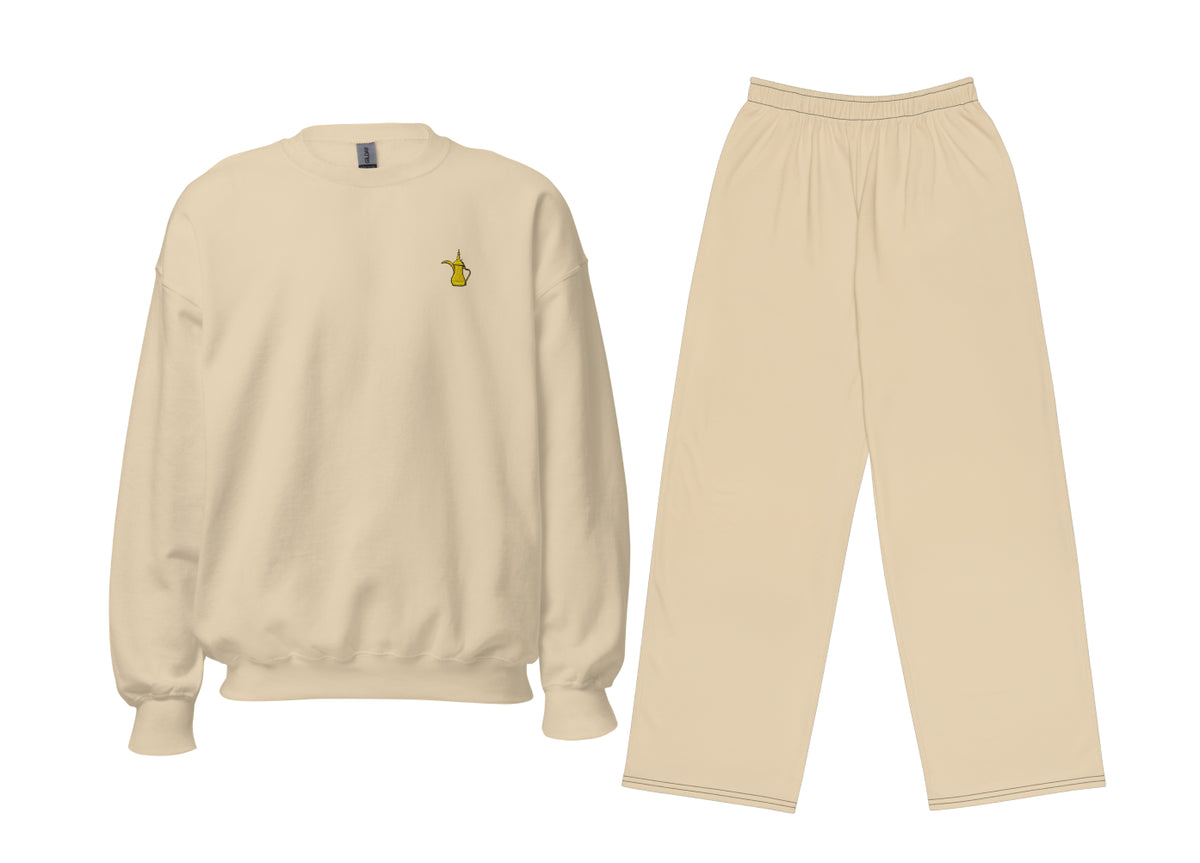 Sand-coloured sweatshirt with a small gold dallah coffee pot chest motif and matching wide-leg on a white background