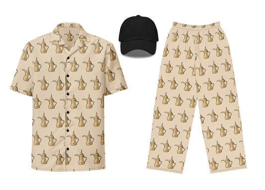 A set of clothing featuring a beige unisex button shirt and pants with a dallat gahwa-themed pattern, and a black unisex embroidered dad hat.