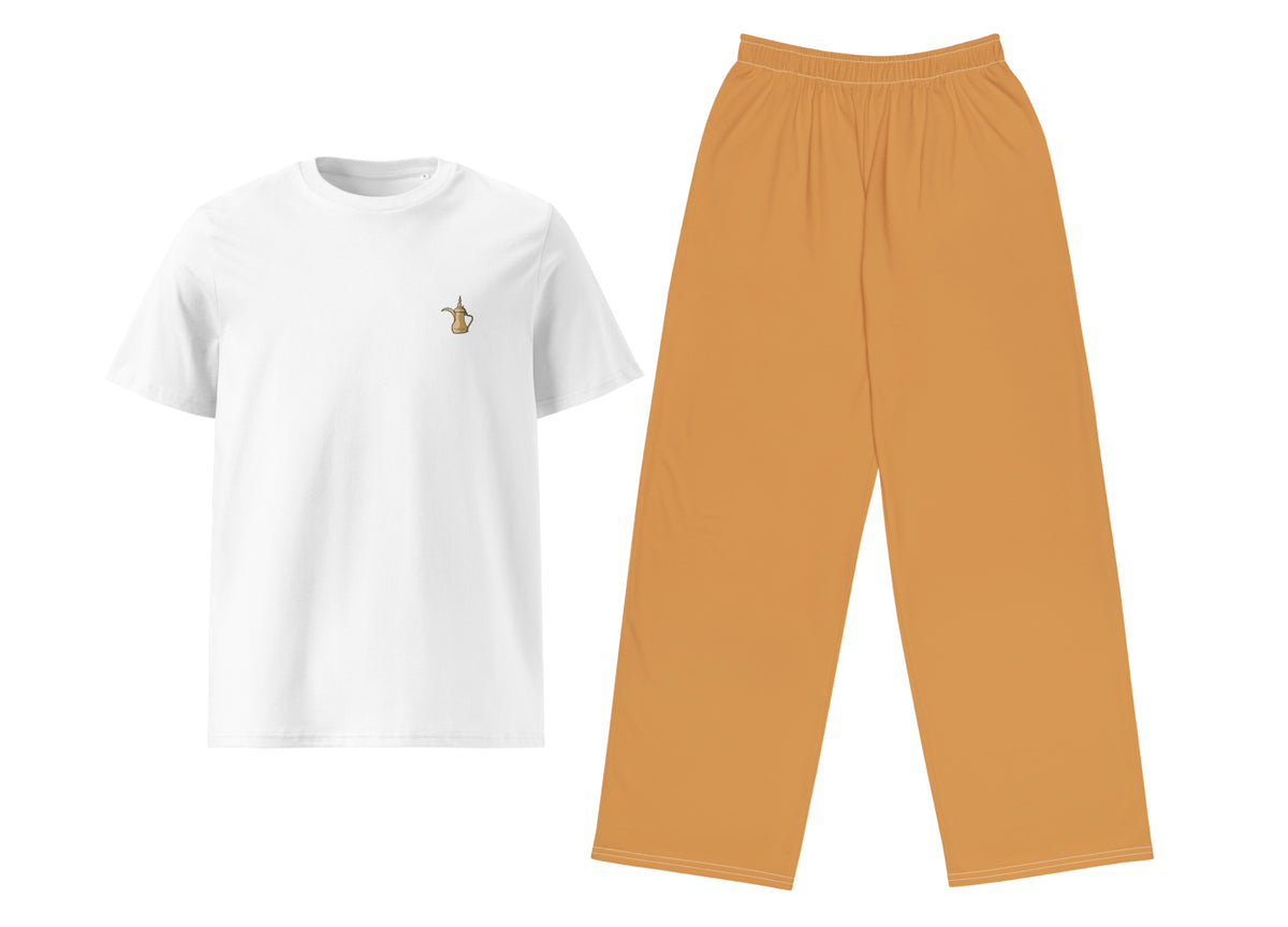 White t-shirt with a small dalla print and light brown pants on a white background