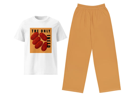 White t-shirt with graphic design and light brown pants on a white background