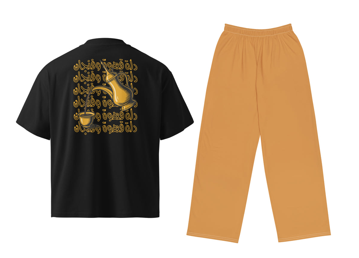 Black t-shirt with gold graphic on the back and Light Brown pants on a white background