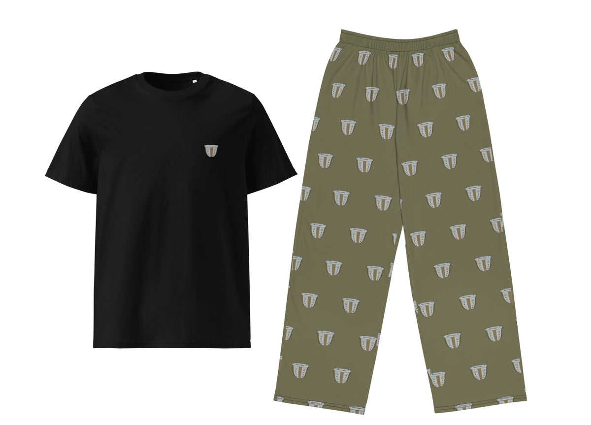 Black t-shirt and green patterned pants on a white background