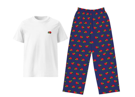 White t-shirt with a small red and green design and blue pants with red and green pattern on a white background