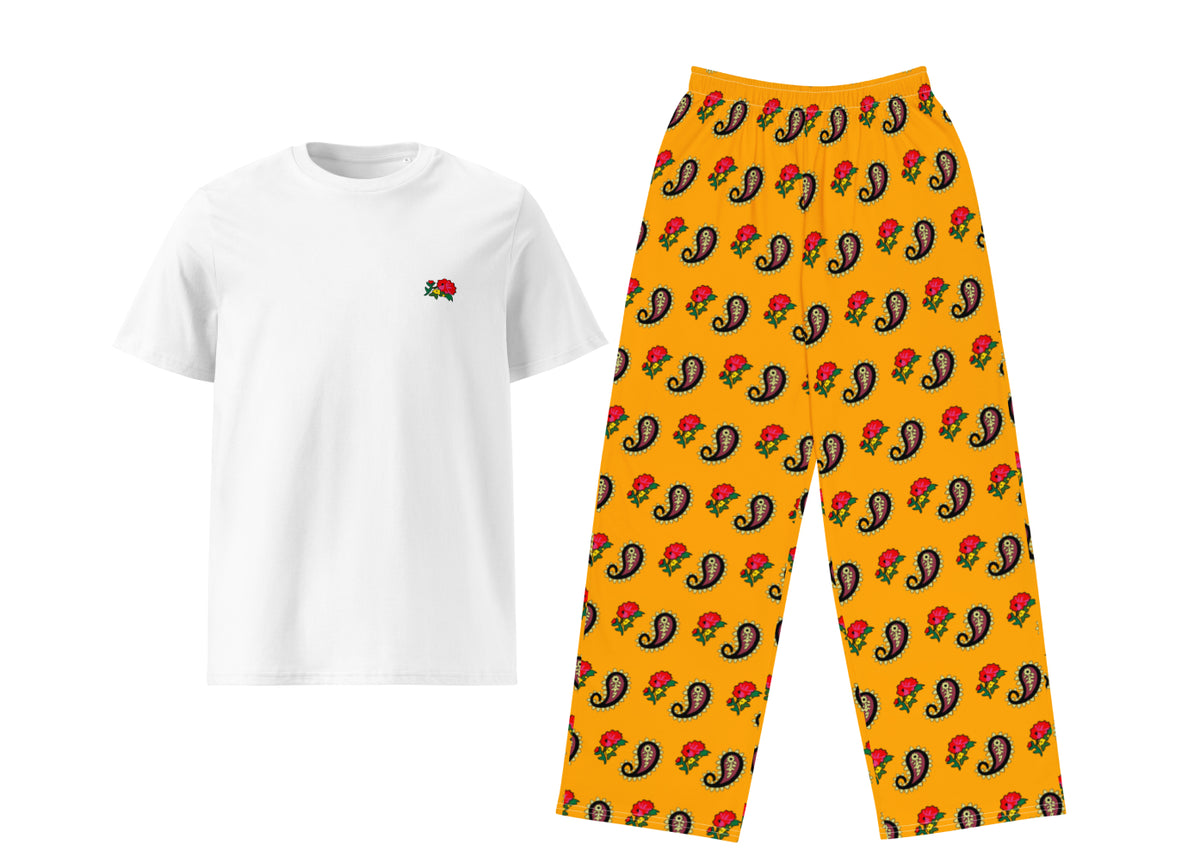 White t-shirt with a small logo and yellow pants with a colorful pattern on a white background
