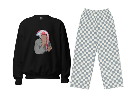 Black sweatshirt with graphic design and checkered pants on a white background