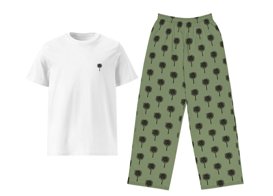 White t-shirt with black design and green pants with palm tree pattern on a white background