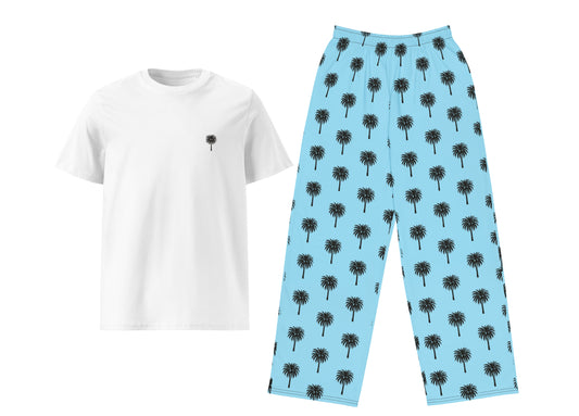White t-shirt with black palm tree design and blue pants with palm tree pattern on a white background