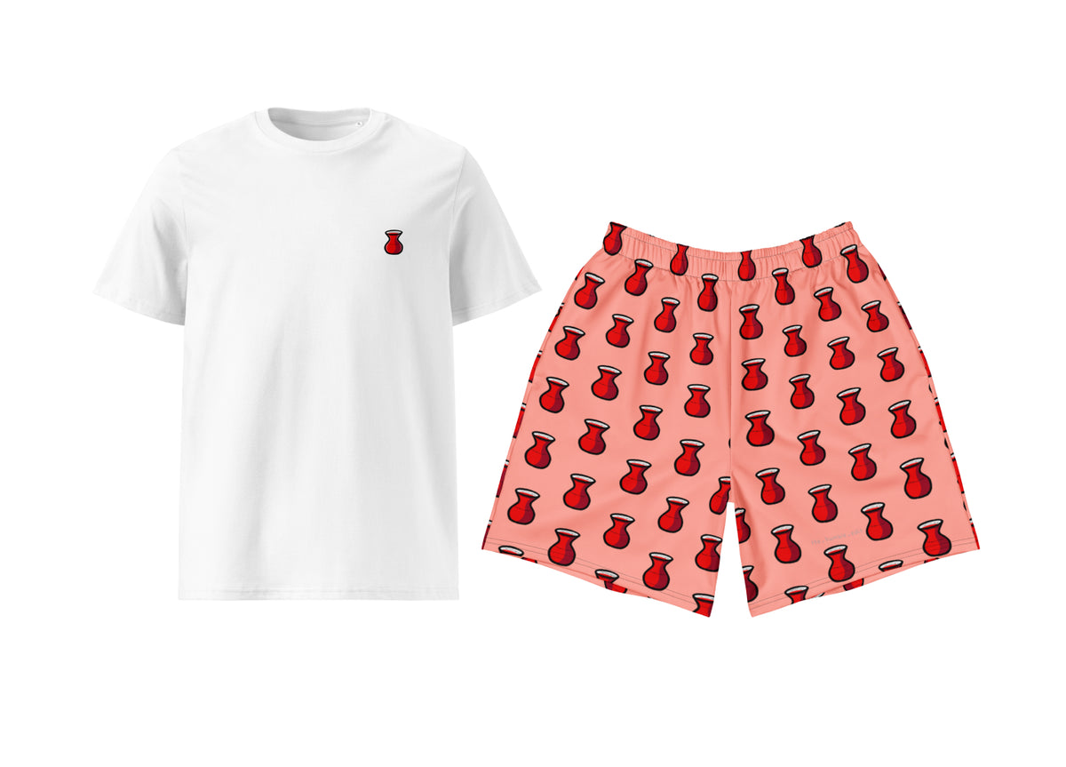 White t-shirt with a small red tea print and pink shorts with red pattern on a white background