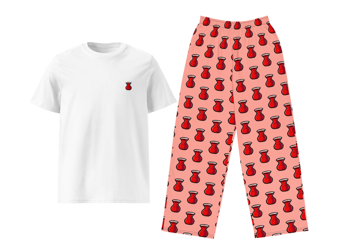 White t-shirt with a small red tea and pink pants with red pattern on a white background