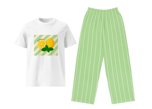 White t-shirt with lemon design and green striped pants on a white background