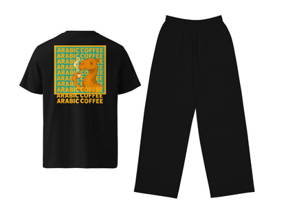A two-piece clothing set consisting of a black short-sleeve t-shirt and black pants, displayed against a solid white background. The back of the t-shirt features a large graphic print with a yellow background, green text reading 'ARABIC COFFEE', and an illustration of a camel.