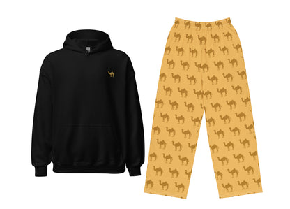 Black hoodie with a small logo and yellow pants with camel pattern on a white background