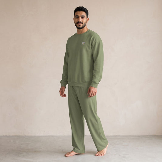 Model wearing a military green Finjan sweatshirt with small coffee cup embroidery on the chest and matching wide-leg pants.