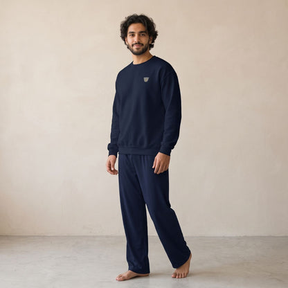 Model wearing a navy sweatshirt with a small finjan coffee cup chest motif and matching wide-leg pants.