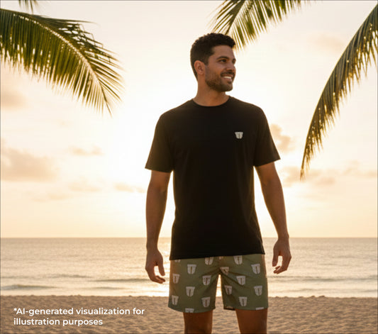 Man standing on a beach with palm trees and sunset in the background