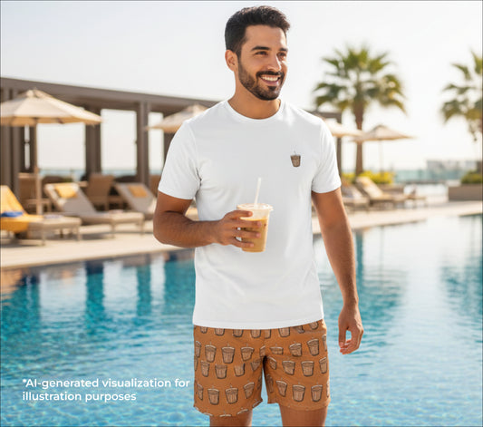 Man holding a drink by a pool with palm trees in the background