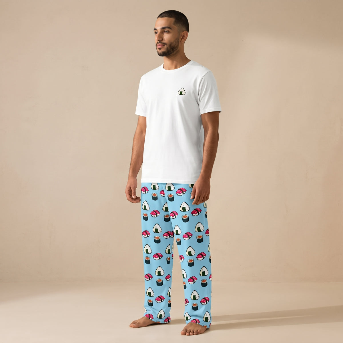 Model wearing a white T-shirt with a small onigiri chest graphic and light blue pants patterned with sushi and onigiri.
