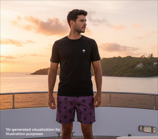 Man standing on a deck with a scenic view of water and sky.