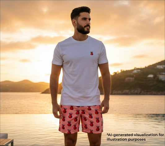 Man wearing a white t-shirt and red shorts with a sunset and water background