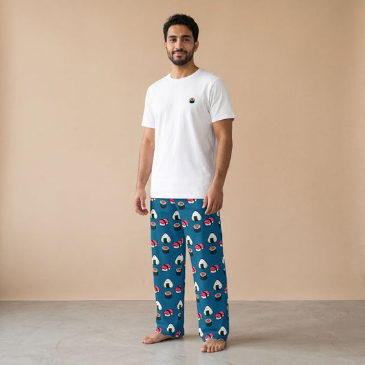 Model wearing a white T-shirt with a small sushi motif and cerulean blue pants with sushi and onigiri prints, front view.