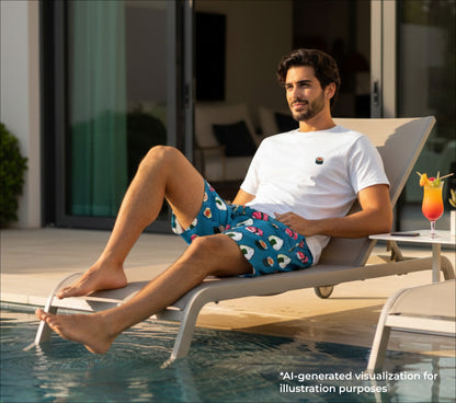 Man lounging on a poolside chair with a pool and outdoor furniture in the background