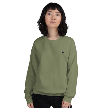 Person wearing a green sweatshirt with a small palm tree on a white background